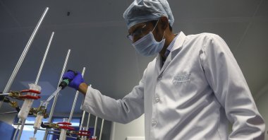 A scientist works at a lab of Huwel Lifesciences that manufactures COVID-19 test kits in Hyderabad, India on Oct. 7, 2021. (AP Photo)