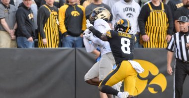 Purdue Boilermakers wide receiver David Bell (3) catches a 21 yard touchdown pass against Iowa Hawkeyes defensive back Matt Hankins (8) during the fourth quarter at Kinnick Stadium, Iowa City, Iowa, U.S., Oct. 16, 2021. (Jeffrey Becker-USA TODAY Sports via Reuters)