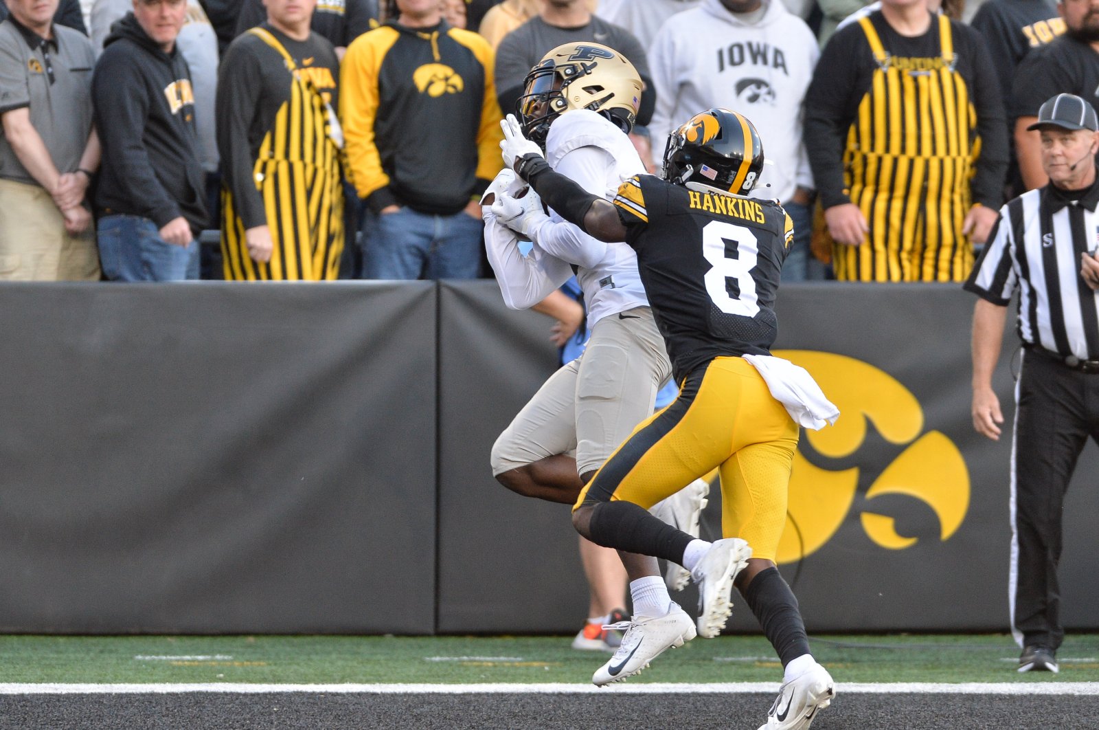 Purdue Boilermakers wide receiver David Bell (3) catches a 21 yard touchdown pass against Iowa Hawkeyes defensive back Matt Hankins (8) during the fourth quarter at Kinnick Stadium, Iowa City, Iowa, U.S., Oct. 16, 2021. (Jeffrey Becker-USA TODAY Sports via Reuters)