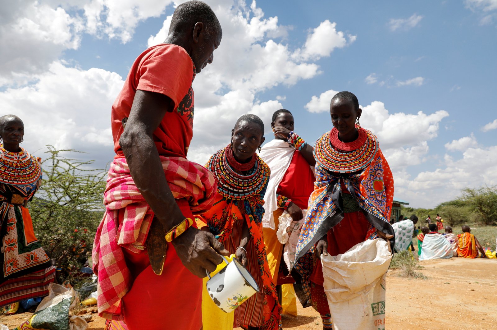 Women from the Samburu tribe receive a food donation given due to an ongoing drought, in the town of Oldonyiro, Isiolo county, Kenya, October 8, 2021. (Reuters File Photo)