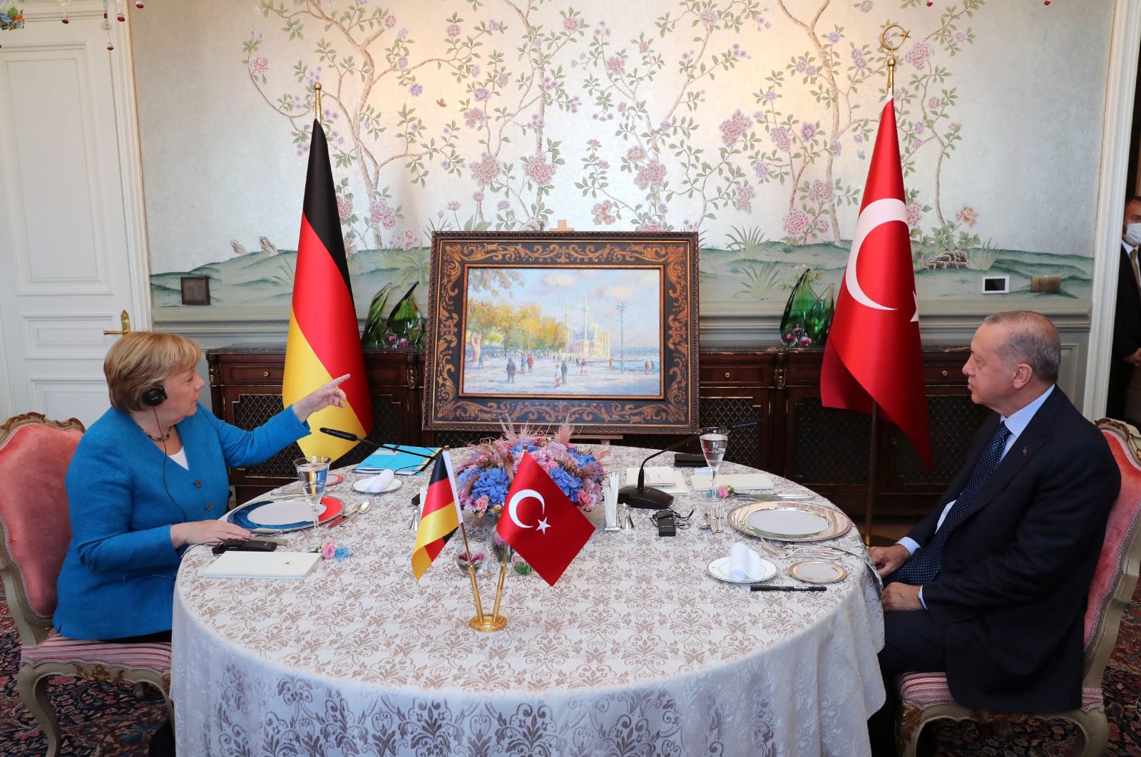 Turkish President Recep Tayyip Erdoğan (R) meeting with German Chancellor Angela Merkel (L) at the Huber mansion in Istanbul, Turkey, Oct. 16, 2021. (Photo by the Turkish Presidential Press via AFP)