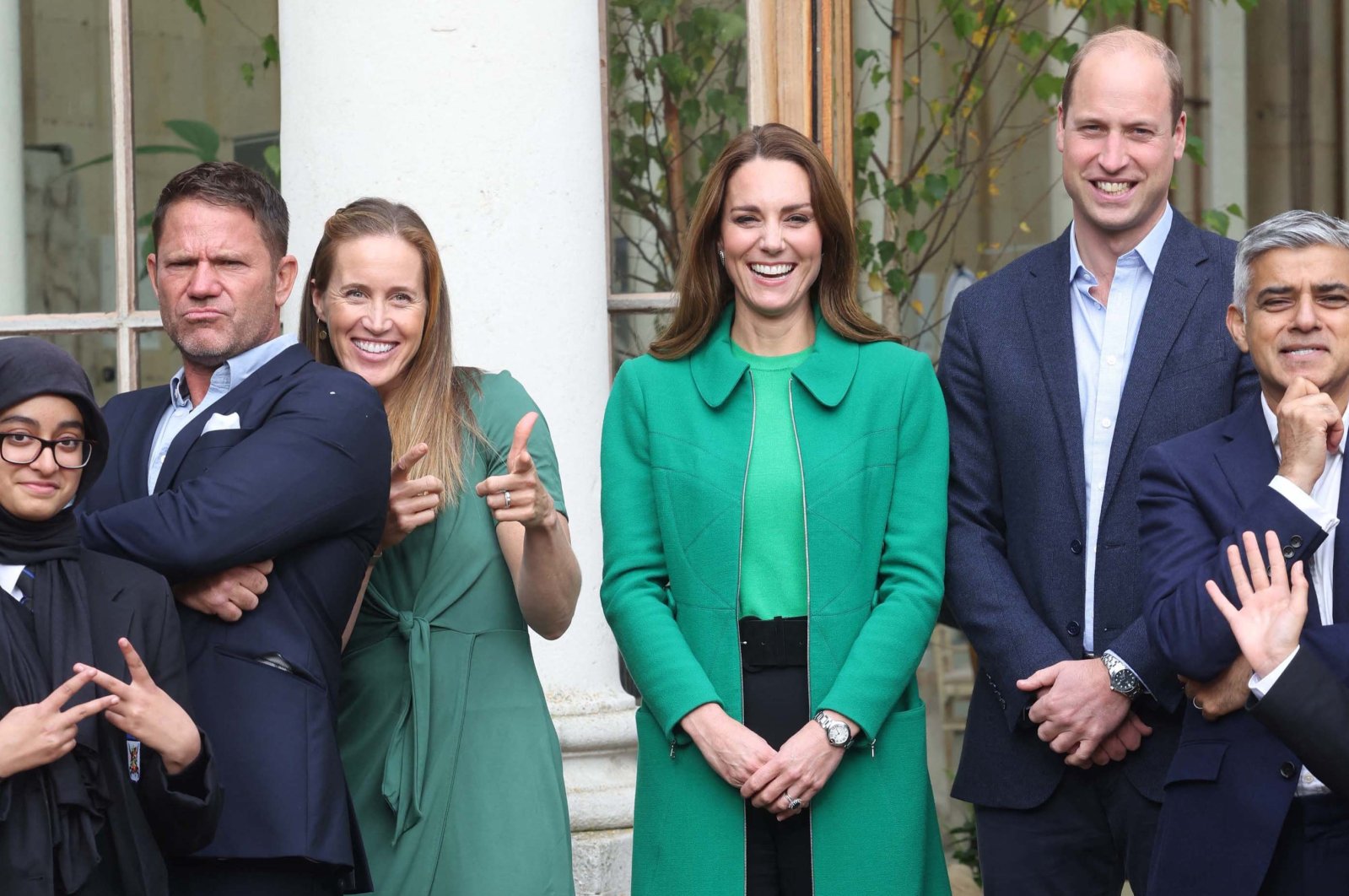 Britain's Prince William, Duke of Cambridge (2R) and Britain's Catherine, Duchess of Cambridge (3R) pose with London Mayor Sadiq Khan (R), naturalist Steve Backshall (2L) and Olympian rower Helen Glover (3L) during their visit to take part in a Generation Earthshot educational initiative comprising of activities designed to generate ideas to repair the planet and spark enthusiasm for the natural world, at Kew Gardens, London, U.K., Oct. 13, 2021. (Pool via AFP)