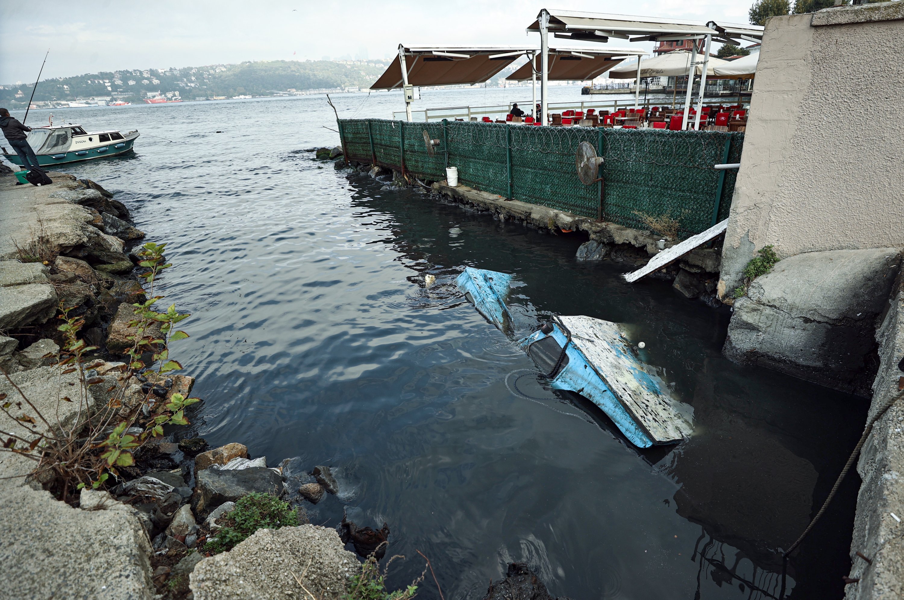 A business is seen to have installed fans to keep the bad smell away near the mouth of the Bekar Stream emptying into the Bosporus, in Çengelköy, Üsküdar district, Istanbul, Oct. 18, 2021. (AA Photo)