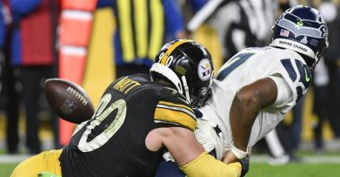 Seattle Seahawks quarterback Geno Smith (7) fumbles as Pittsburgh Steelers outside linebacker T.J. Watt (90) tackles him during overtime, Pittsburgh, Pennsylvania, U.S., Oct. 17, 2021. (AP Photo)