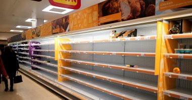 Shelves are left empty of fresh chicken in a supermarket, London, Britain, March 15, 2020. (Reuters Photo)
