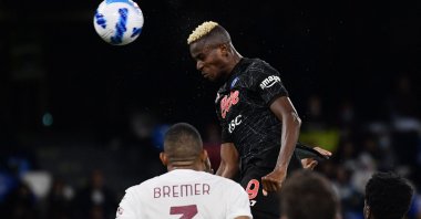 Napoli's Nigerian forward Victor Osimhen scores a header during a Serie A match against Torino at the Diego-Maradona stadium in Naples, Italy, Oct. 17, 2021. (AFP Photo)