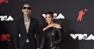 Travis Barker (L) and Kourtney Kardashian arrive at the MTV Video Music Awards at Barclays Center, New York, U.S., Sept. 12, 2021. (AP Photo)