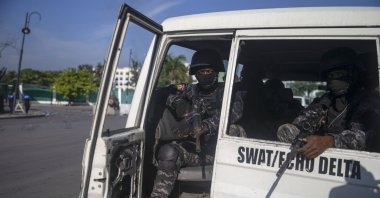 Armed forces secure the area where the Haiti's Prime Minister Ariel Henry placed a bouquet of flowers in front of independence hero Jean Jacques Dessalines memorial in Port-au-Prince, Haiti, Oct. 17, 2021. (AP Photo)