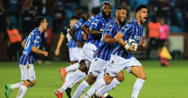 Trabzonspor's Anastasios Bakasetas (R) celebrates with teammates after scoring in a Turkish Süper Lig match against Fenerbahçe, Trabzon, northeast Turkey, Oct 17, 2021. (IHA Photo)