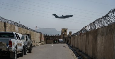A C-17 Globemaster takes off as Taliban fighters secure the outer perimeter, alongside the American controlled side of of the Hamid Karzai International Airport in Kabul, Afghanistan, Aug. 29, 2021. (Photo by Getty Images)