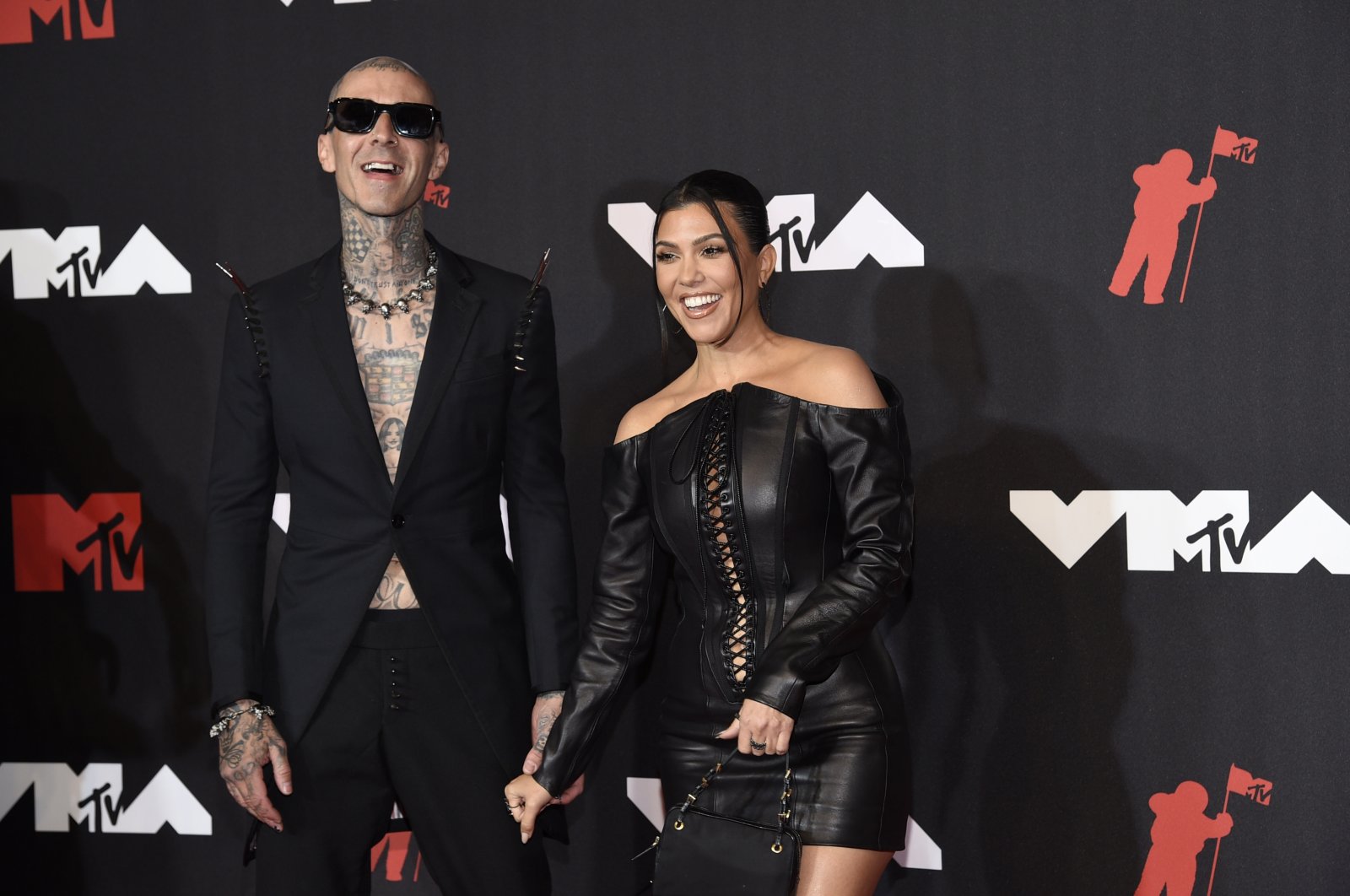 Travis Barker (L) and Kourtney Kardashian arrive at the MTV Video Music Awards at Barclays Center, New York, U.S., Sept. 12, 2021. (AP Photo)