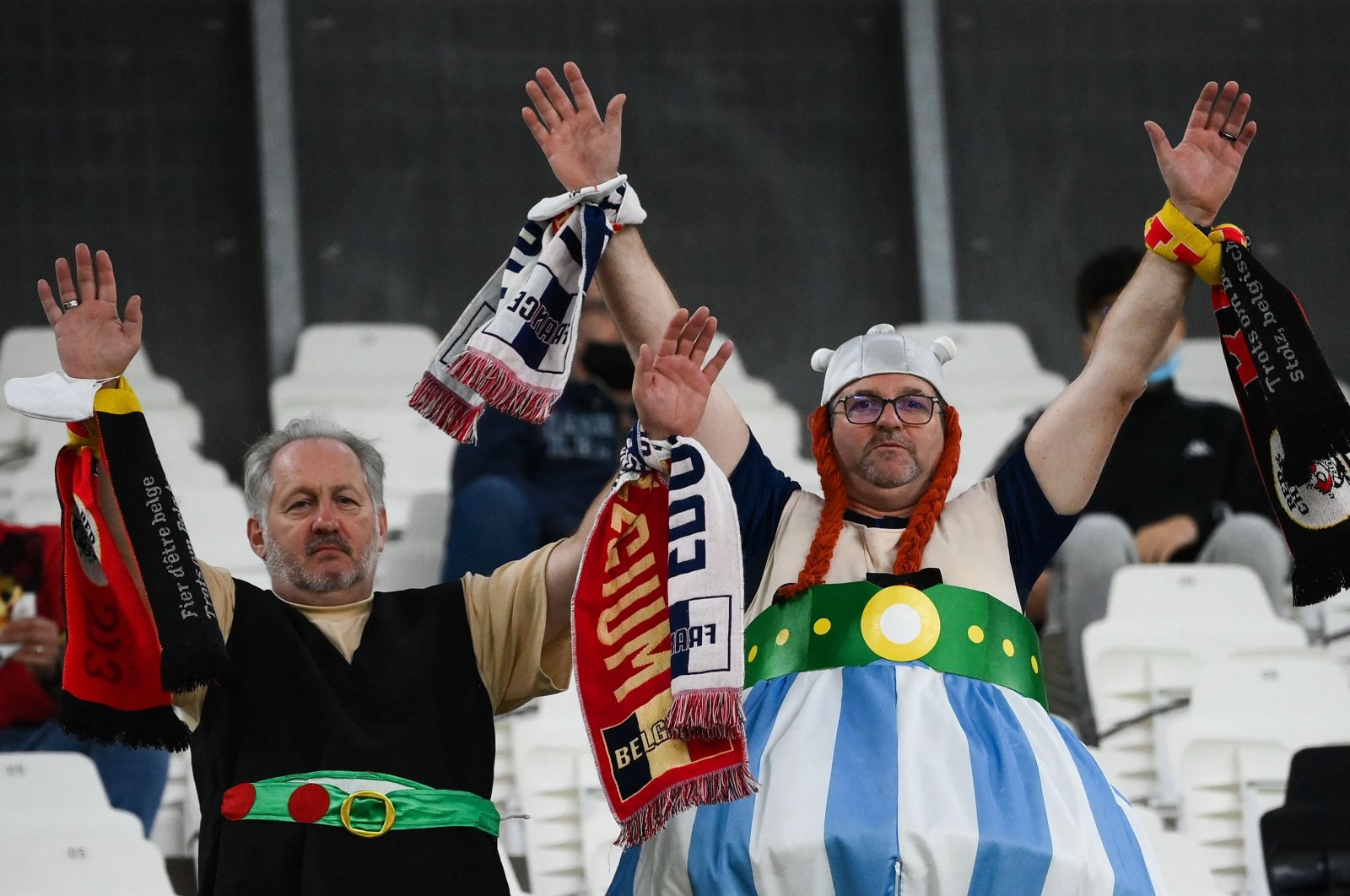 France's supporters dressed like comic characters Asterix and Obelix cheer prior to the UEFA Nations League semifinal football match between Belgium and France at the Juventus stadium in Turin, Italy, Oct. 7, 2021. (AFP Photo)