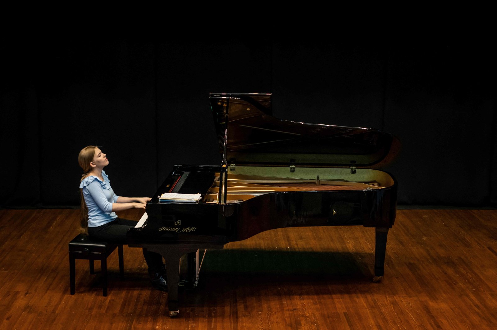 Eva Gevorgyan, 17, from Russia, one of the finalists of the 18th International Chopin Piano Competition, performs during a rehearsal at the Russian Culture Center in Warsaw, Poland, Oct. 11, 2021. (AFP Photo)