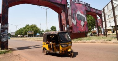 A rick-shaw drive past city gate in Sokoto, northwest Nigeria, Sept. 22, 2021. (AFP Photo)