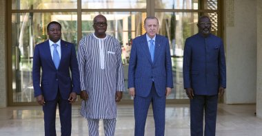 President Recep Tayyip Erdoğan (2R), Togo President Faure Gnassingbe (L), Burkina Faso President Christian Kabore (2L) and Liberia President George Weah pose for a picture ahead of a working dinner, in Lome, Togo, Oct. 19, 2021. (AA Photo)