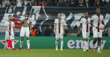 Beşiktaş players walk along the pitch after Sporting CP scored its third goal during Champions League group C football match between Beşiktaş and Sporting CP at the Vodafone Park Stadium in Istanbul, Turkey, Oct. 19, 2021. (AP Photo)