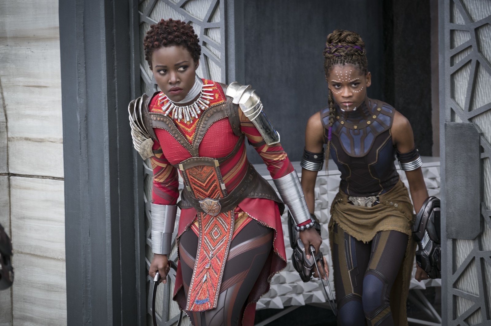 This image released by Disney shows Lupita Nyong'o (L) and Letitia Wright in a scene from Marvel Studios' "Black Panther." (AP)