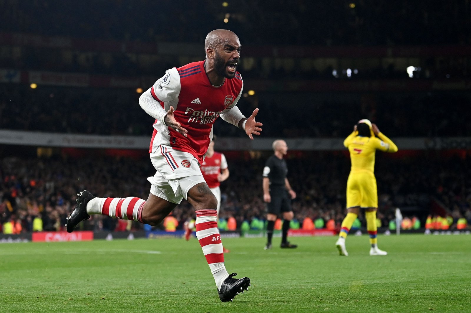 Arsenal's Alexandre Lacazette celebrates scoring his team's second goal during a Premier League match against Crystal Palace at the Emirates, London, England, Oct. 18, 2021. (AFP Photo)