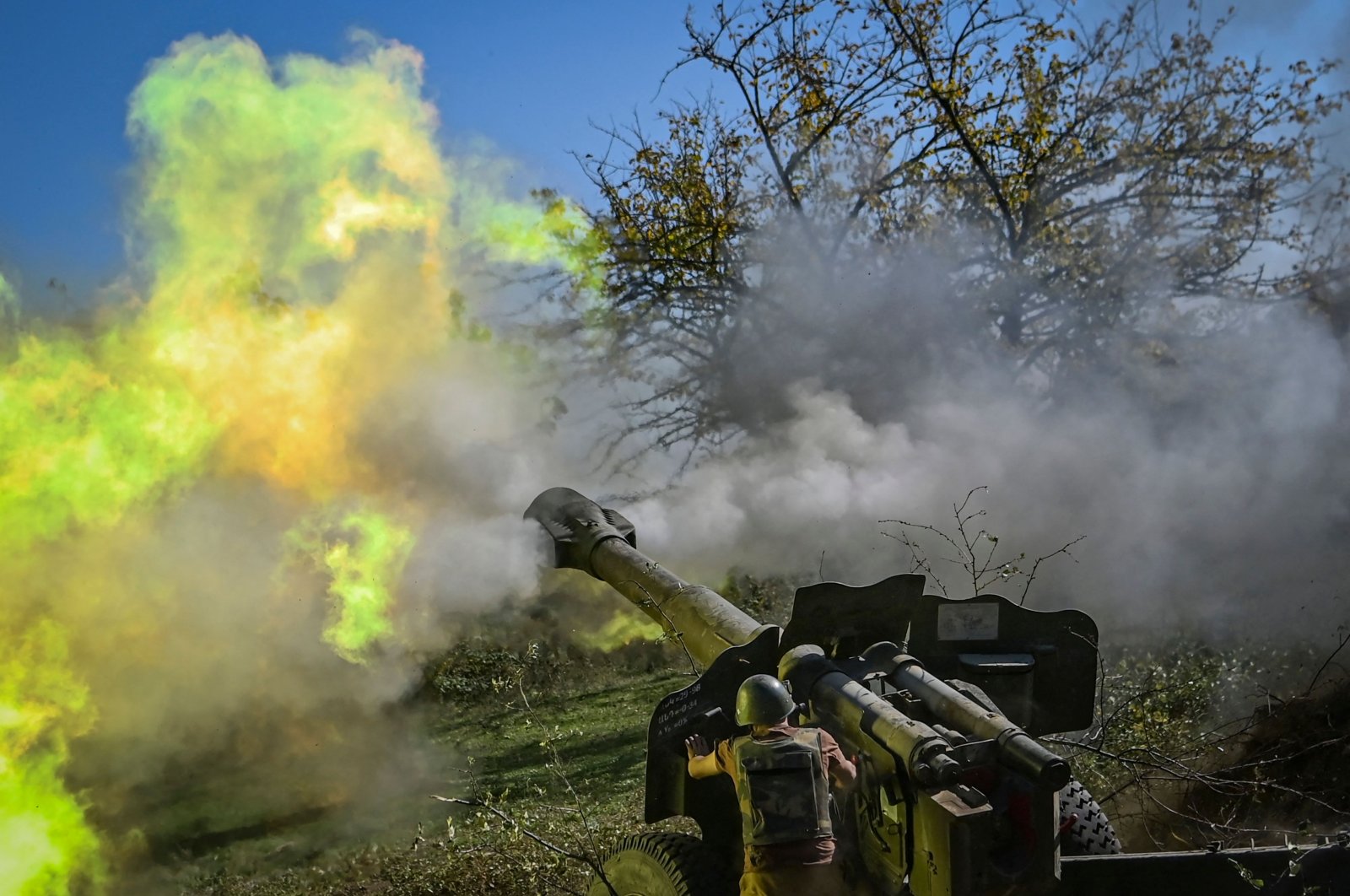 Armenian soldier fires artillery on the front line, during the ongoing fighting between Armenian and Azerbaijani forces over the breakaway region of Nagorno-Karabakh, Azerbaijan, Oct. 25, 2020. (AFP Photo)
