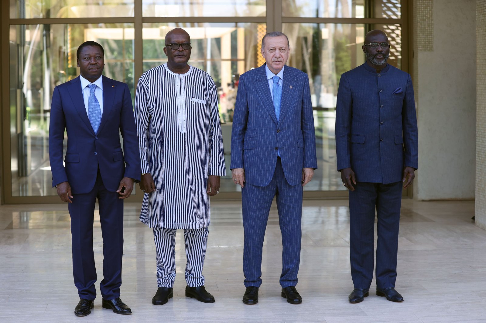 President Recep Tayyip Erdoğan (2R), Togo President Faure Gnassingbe (L), Burkina Faso President Christian Kabore (2L) and Liberia President George Weah pose for a picture ahead of a working dinner, in Lome, Togo, Oct. 19, 2021. (AA Photo)