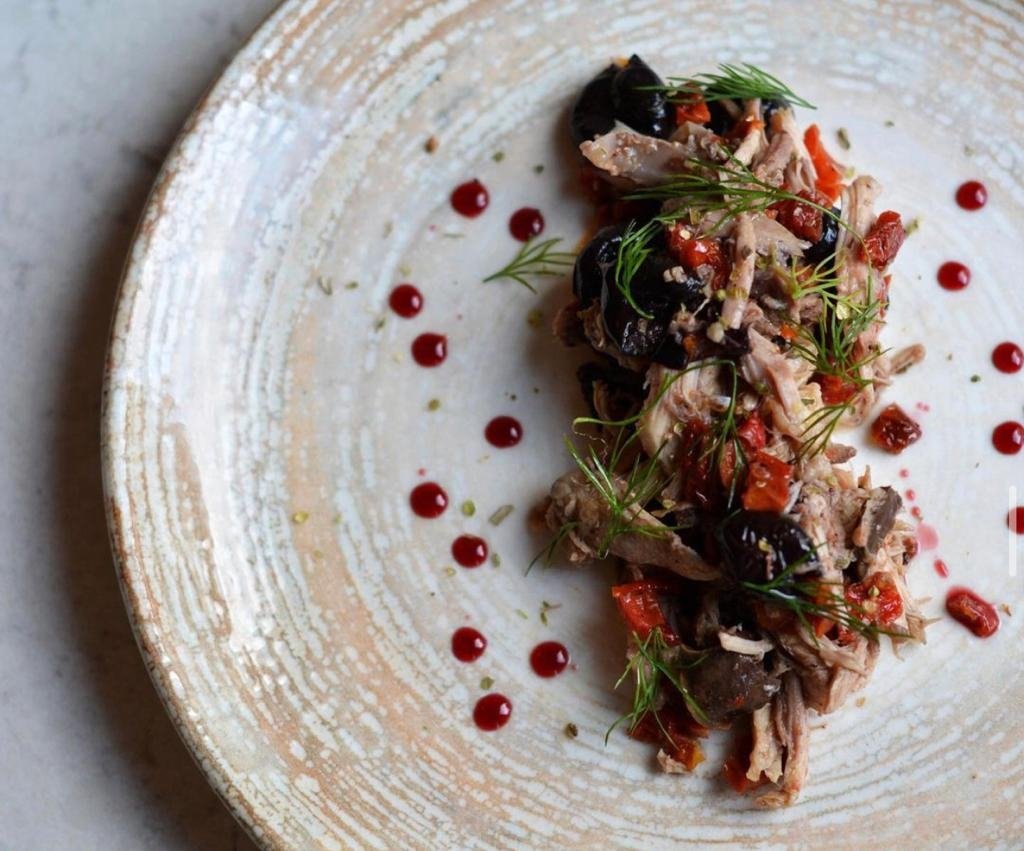 Rabbit with dried tomatoes, olives and fennel leaves. (Photo from Instagram / @aidavinoecucina)
