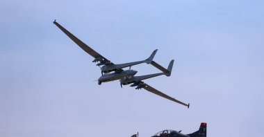 Aksungur UAV performs a demonstration flight alongside training aircraft Hürkuş during Teknofest, Istanbul, Turkey, Sept. 25, 2021. (AA Photo)