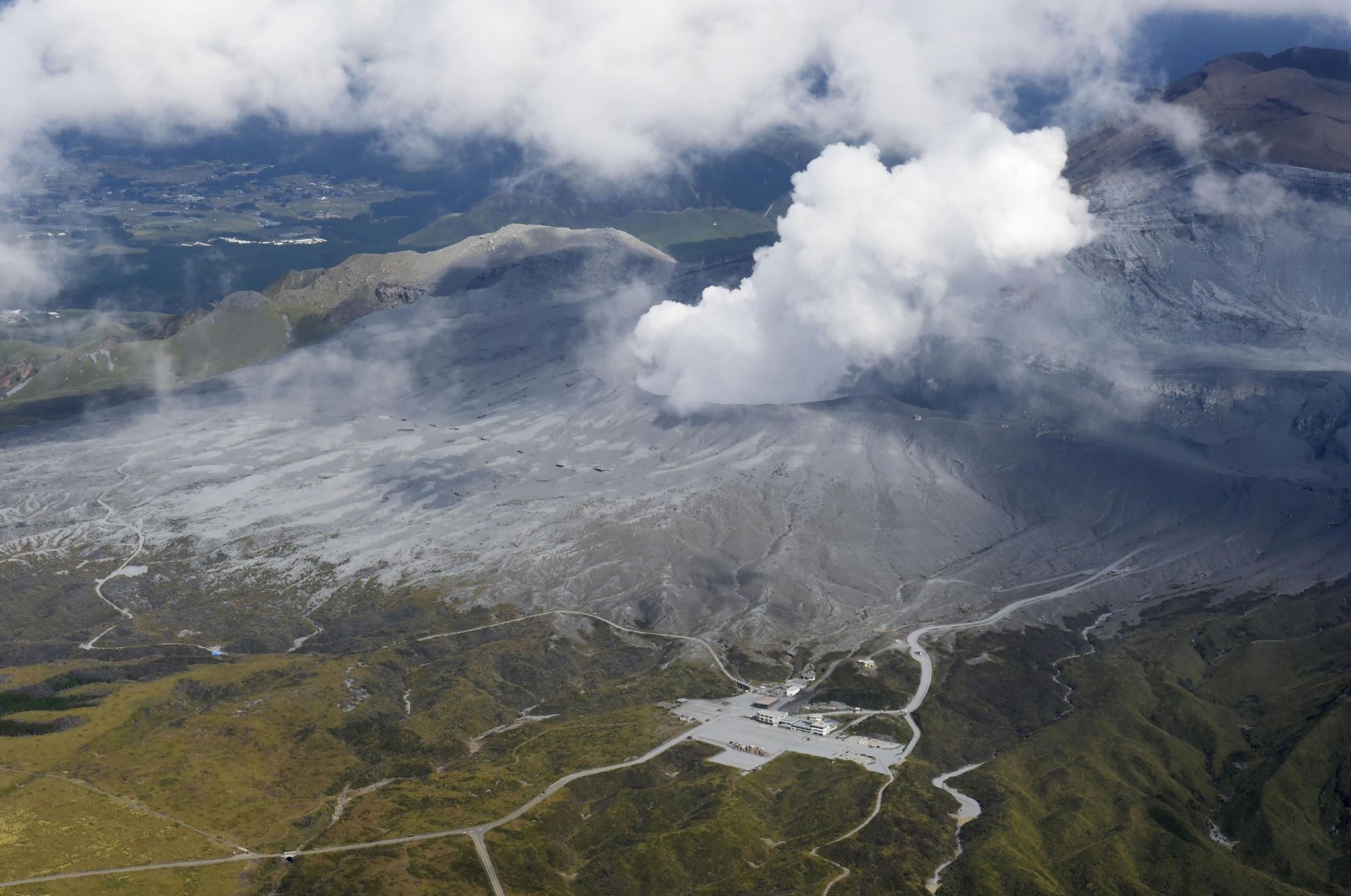 Smoke rises from a crater of Mr. Aso, Kumamoto prefecture, southwestern Japan, Oct. 20, 2021. (AP Photo)
