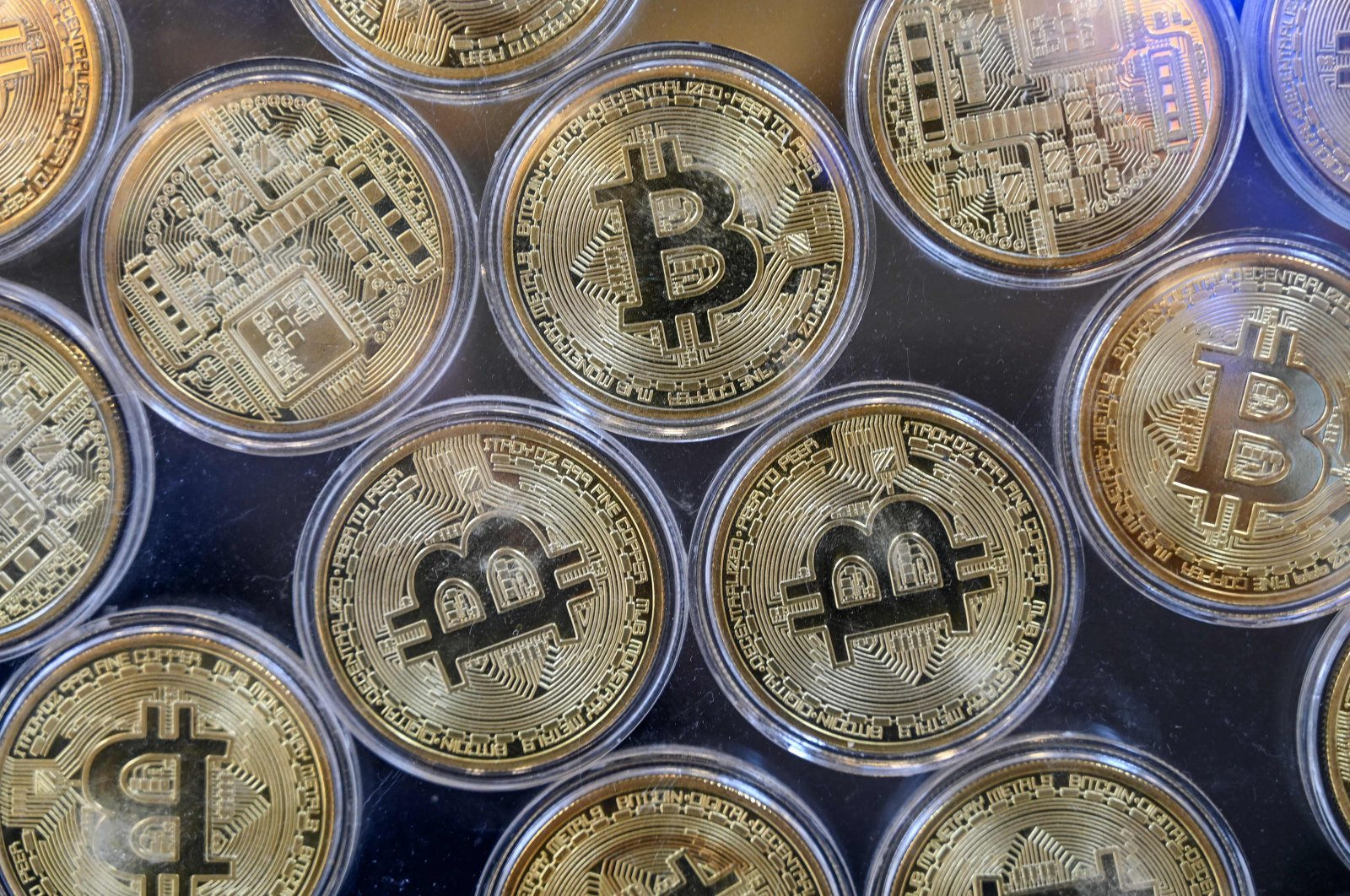 Physical imitations of bitcoins are pictured at a cryptocurrency exchange branch near the Grand Bazaar in Istanbul, Turkey, Oct. 20, 2021. (AFP Photo)