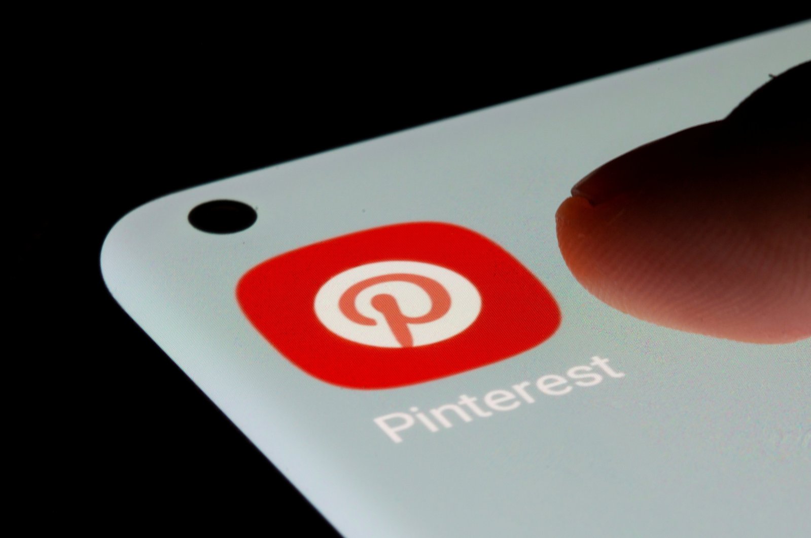 The Pinterest app is seen on a smartphone in this illustration created on July 13, 2021. (Reuters Photo)
