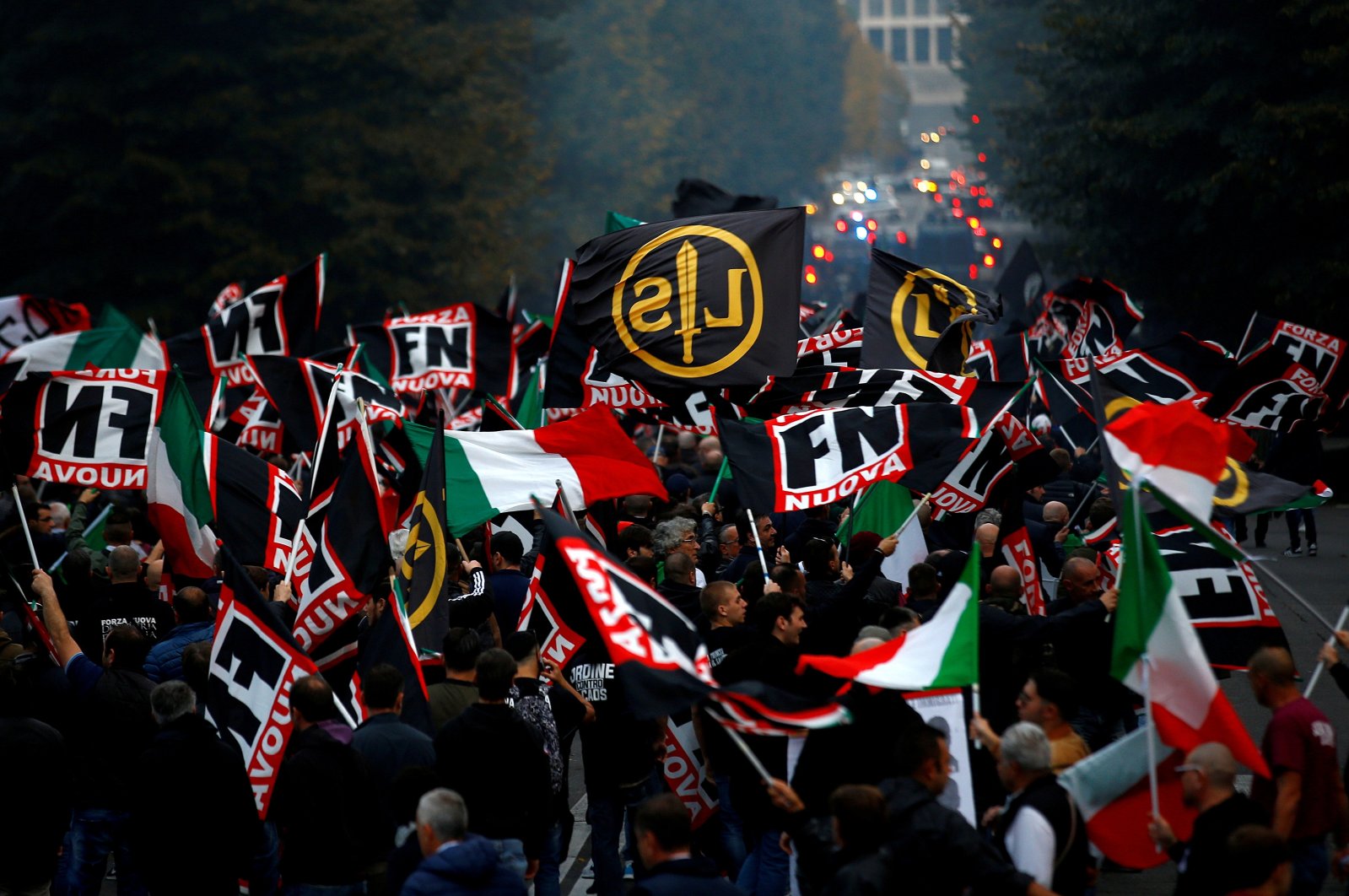 Supporters of Italy's far-right Forza Nuova party wave flags during a demonstration in Rome, Italy, Nov. 4, 2017. (Reuters Photo)