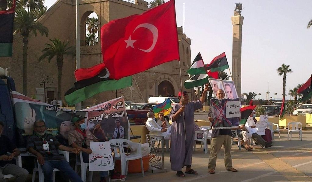 Libyans hold Turkish and Libyan flags together in a protest against putschist Gen. Khalifa Haftar's forces in the eastern part of the country, Tripoli, Libya, July 12, 2021. (AA Photo)