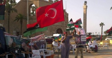 Libyans hold Turkish and Libyan flags together in a protest against putschist Gen. Khalifa Haftar's forces in the eastern part of the country, Tripoli, Libya, July 12, 2021. (AA Photo)