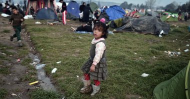 A child plays at a makeshift camp at the Greek-Macedonian borders, where the "Balkan route" once carried thousands of refugees to Europe, near the village of Idomeni, Greece, March 8, 2016. (AFP)