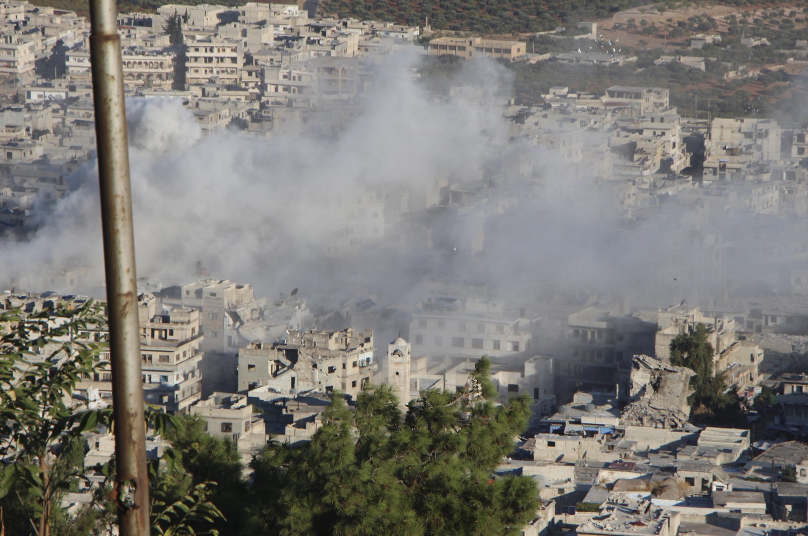 Smoke rising from Syrian regime shelling on the northern town of Ariha, in Idlib province, northwestern Syria, Oct. 20, 2021. (AP Photo)
