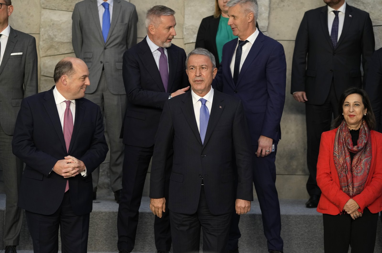 Front row from left, British Defense Minister Ben Wallace, Defense Minister Hulusi Akar and Spain's Defense Minister Maria Margarita Robles Fernandez pose during a group photo of NATO defense ministers at NATO headquarters in Brussels, Thursday, Oct. 21, 2021. (AP File Photo)