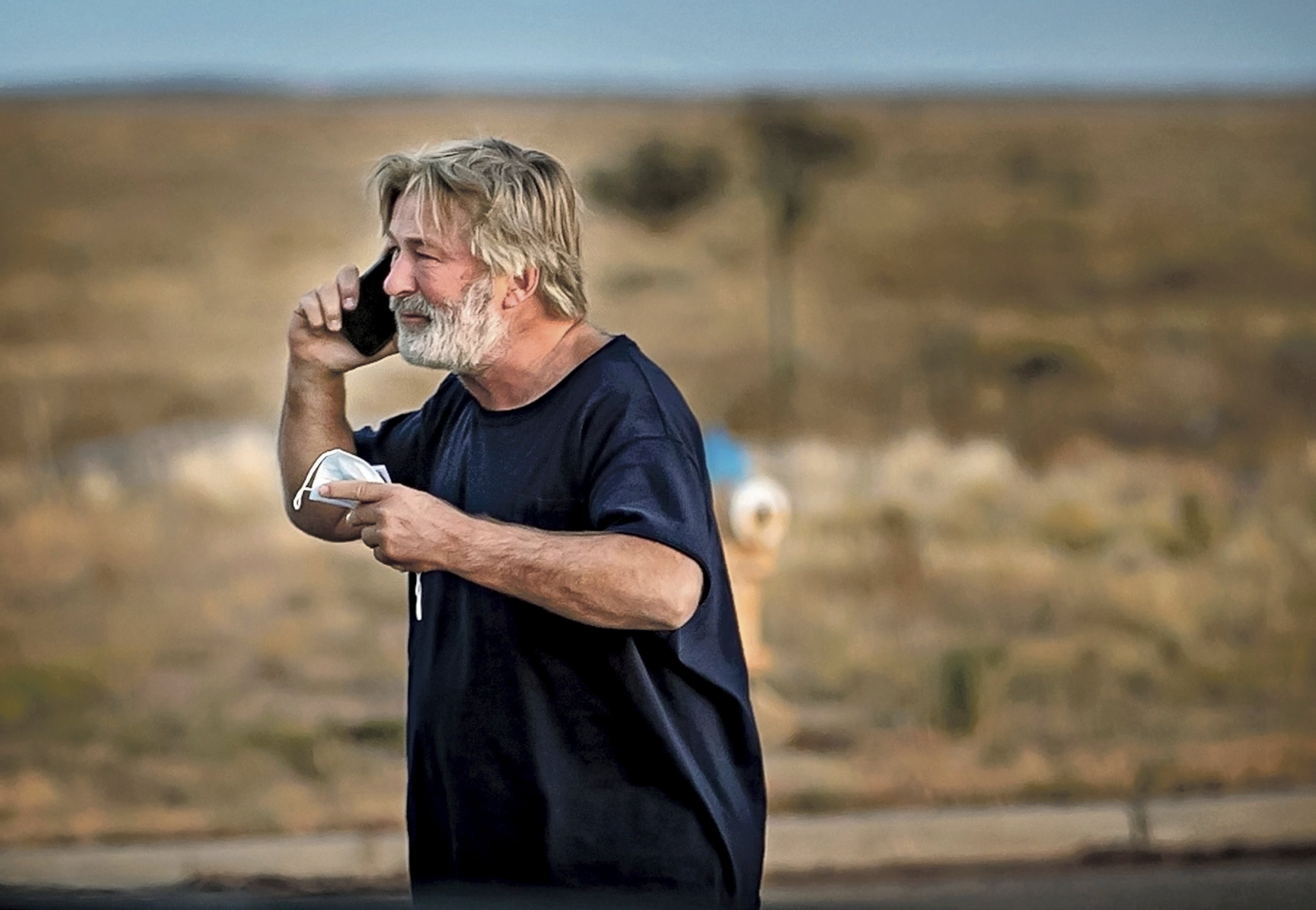Alec Baldwin speaks on the phone in the parking lot outside the Santa Fe County Sheriff's Office in Santa Fe, New Mexico, U.S., Oct. 21, 2021. (AP Photo)