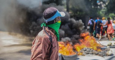 Blazing barricades burn after being set on fire by groups of motorcycle taxi drivers to protest against fuel shortages in Port-au-Prince, Haiti, Oct. 21, 2021. (AFP Photo)