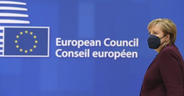 Germany's Chancellor Angela Merkel arrives to a round table meeting at an EU summit in Brussels, Belgium, Friday, Oct. 22, 2021. (Pool Photo via AP)