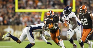 Cleveland Browns running back D'Ernest Johnson (30) runs the ball past the Denver Broncos defense during the second quarter at FirstEnergy Stadium, Cleveland, Ohio, U.S., Oct. 21, 2021. (Scott Galvin-USA TODAY Sports via Reuters)