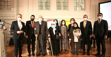 YTB President Abdullah Eren (2nd L) poses with former "guest workers" and officials at the event, in Stuttgart, Germany, Oct. 21, 2021. (COURTESY OF YTB)