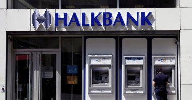 A customer uses an automated teller machine at a branch of Halkbank in Istanbul, Turkey, Aug. 15, 2014. (Reuters Photo)