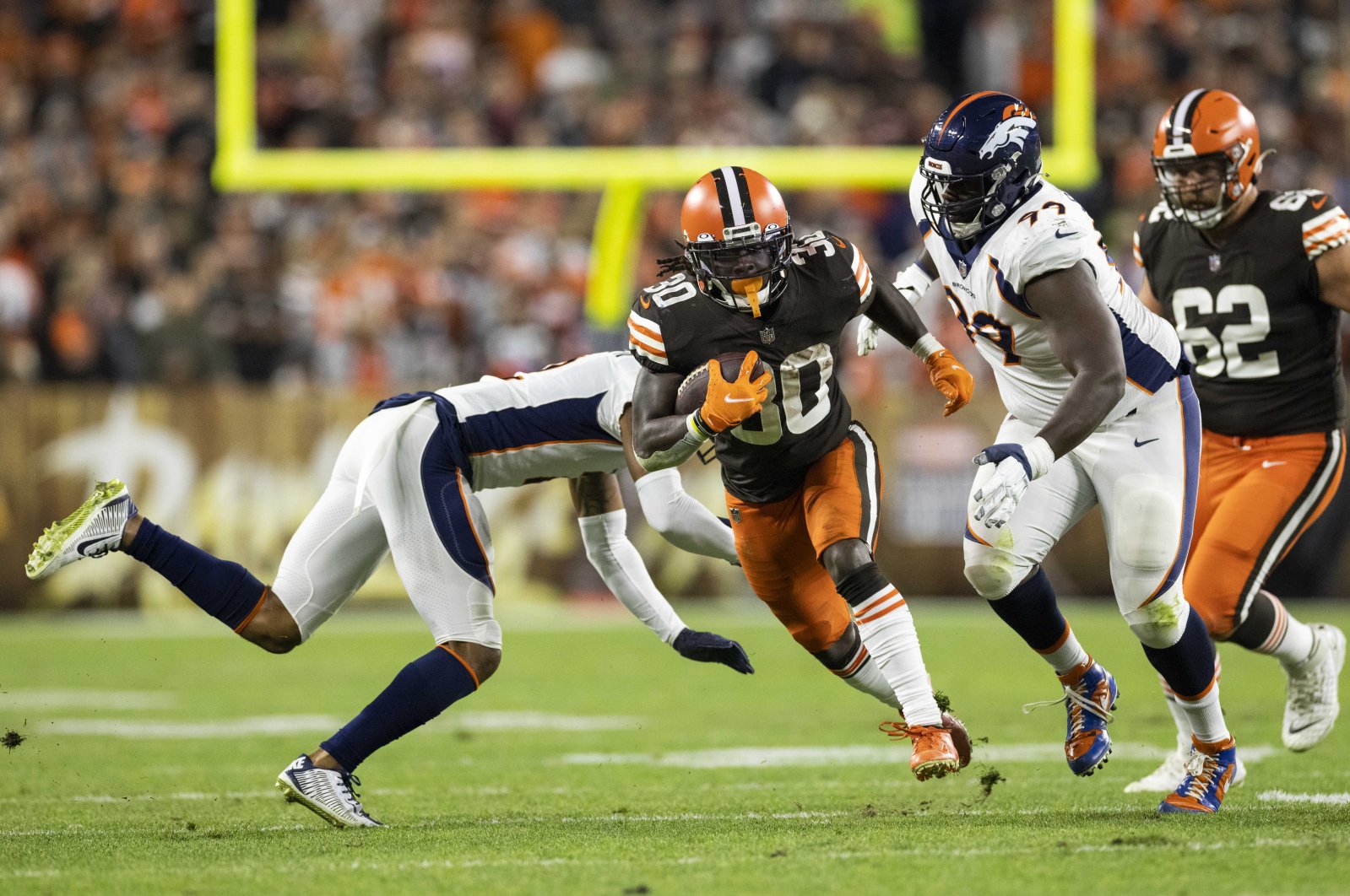 Cleveland Browns running back D'Ernest Johnson (30) runs the ball past the Denver Broncos defense during the second quarter at FirstEnergy Stadium, Cleveland, Ohio, U.S., Oct. 21, 2021. (Scott Galvin-USA TODAY Sports via Reuters)