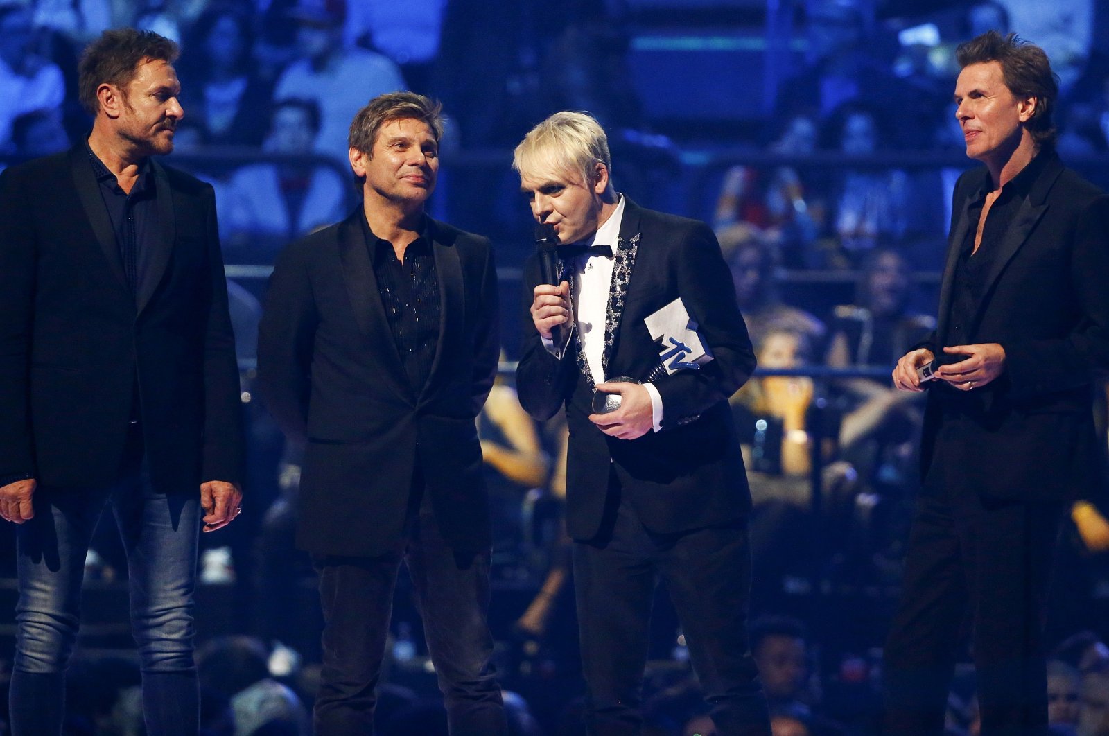 Duran Duran band members talk on stage after receiving the "Video Visionary" award during the MTV EMA awards at the Assago forum in Milan, Italy, Oct. 25, 2015.  (REUTERS Photo)