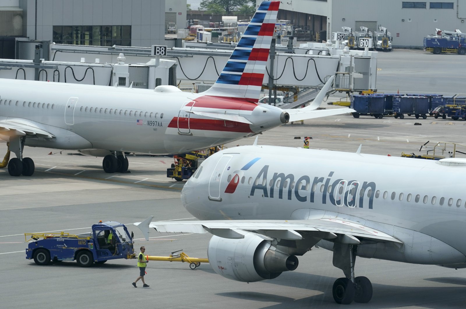 American Airlines passenger jets prepare for departure, near a terminal at Boston Logan International Airport, in Boston, U.S., July 21, 2021. (AP Photo)