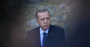 President Recep Tayyip Erdoğan at a joint news conference with German Chancellor Angela Merkel in Istanbul, Turkey, Oct. 16, 2021. (AP Photo)