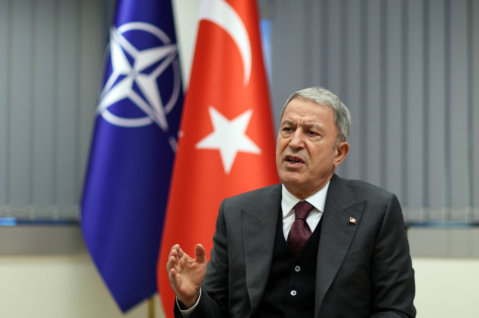 Turkey's Defense Minister Hulusi Akar speaking to journalists after a NATO meeting in Brussels, Belgium Oct. 23.2021 (AA Photo)

