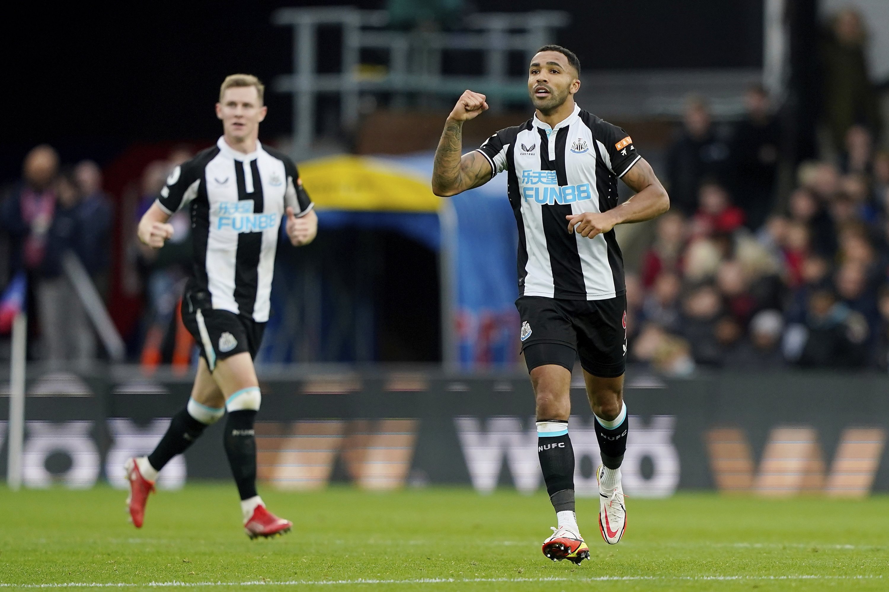 Newcastle's Callum Wilson (R) celebrates scoring against Crystal Palace during a Premier League match at Selhurst Park in London, England, Oct. 23, 2021. (AP Photo)