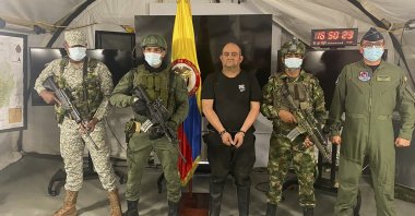 In this photo released by the Colombian presidential press office, one of the country’s most wanted drug traffickers, Dairo Antonio Usuga, alias “Otoniel,” leader of the violent Clan del Golfo cartel, is presented to the media at a military base in Necocli, Colombia, Oct. 23, 2021. (AP Photo)