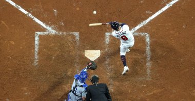 Eddie Rosario (8) of the Atlanta Braves flies out during the eighth inning of Game 6 of the National League Championship Series against the Los Angeles Dodgers at Truist Park, Atlanta, Georgia, U.S., Oct. 23, 2021. (AFP Photo)