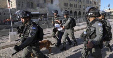 Israeli border police officers detain a Palestinian youth during clashes between Palestinians and Israeli police as thousands of Muslims flocked to Jerusalem's Old City to celebrate the Prophet Muhammad's birthday, East Jerusalem, occupied Palestine, Oct. 19, 2021. (AP Photo)